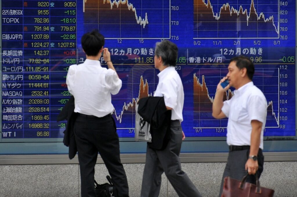 Japan stock market surpasses March record high as US dollar falls in Tokyo