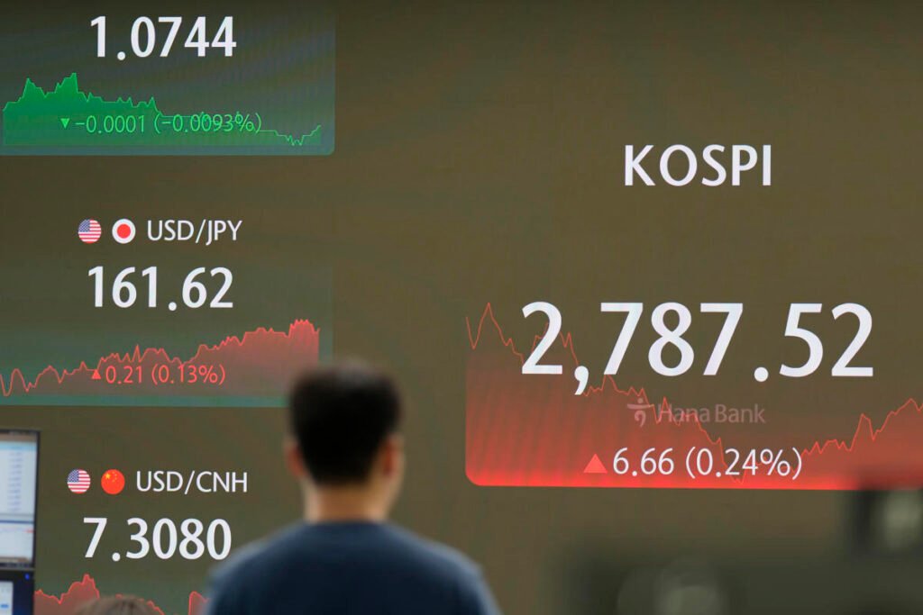 Asian stocks mostly rise as Tesla’s rapid growth drives Wall Street to new record